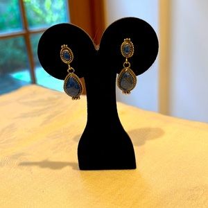 Sterling silver dangle earrings with blue stones.